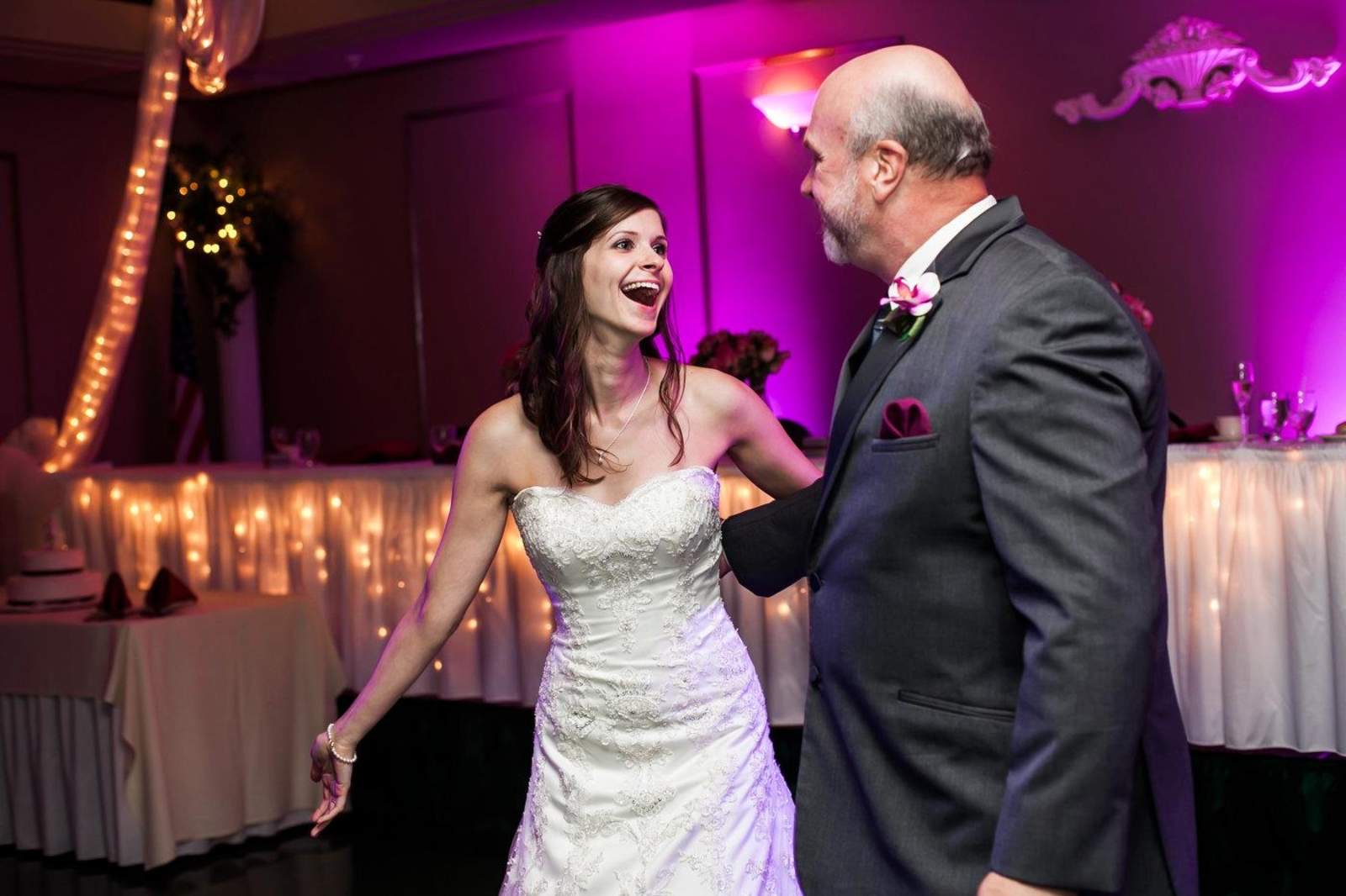 A bride dancing with her father