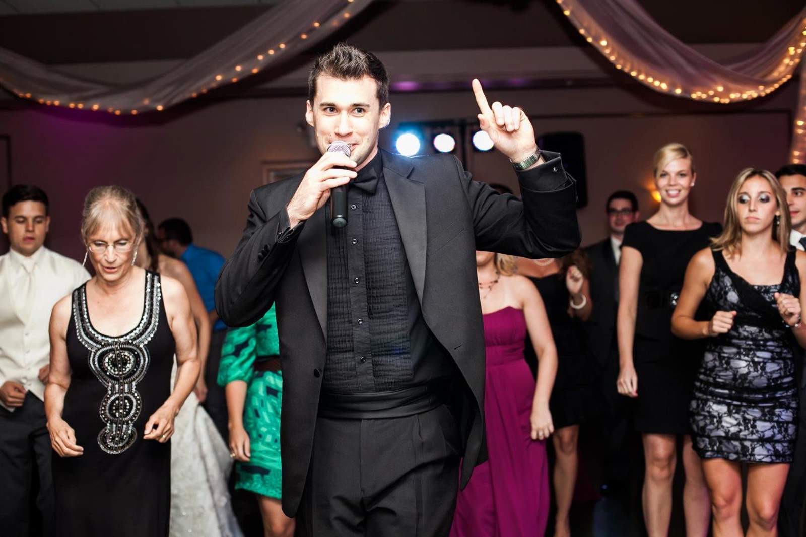 Todd on the mic, leading a packed dance floor