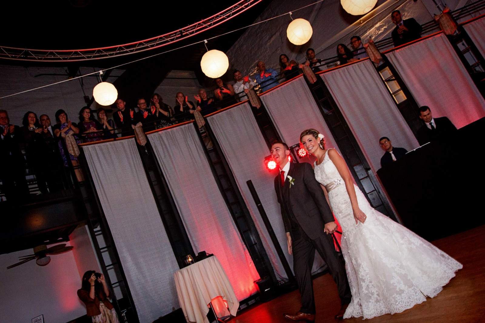 A reception room glowing with red uplighting